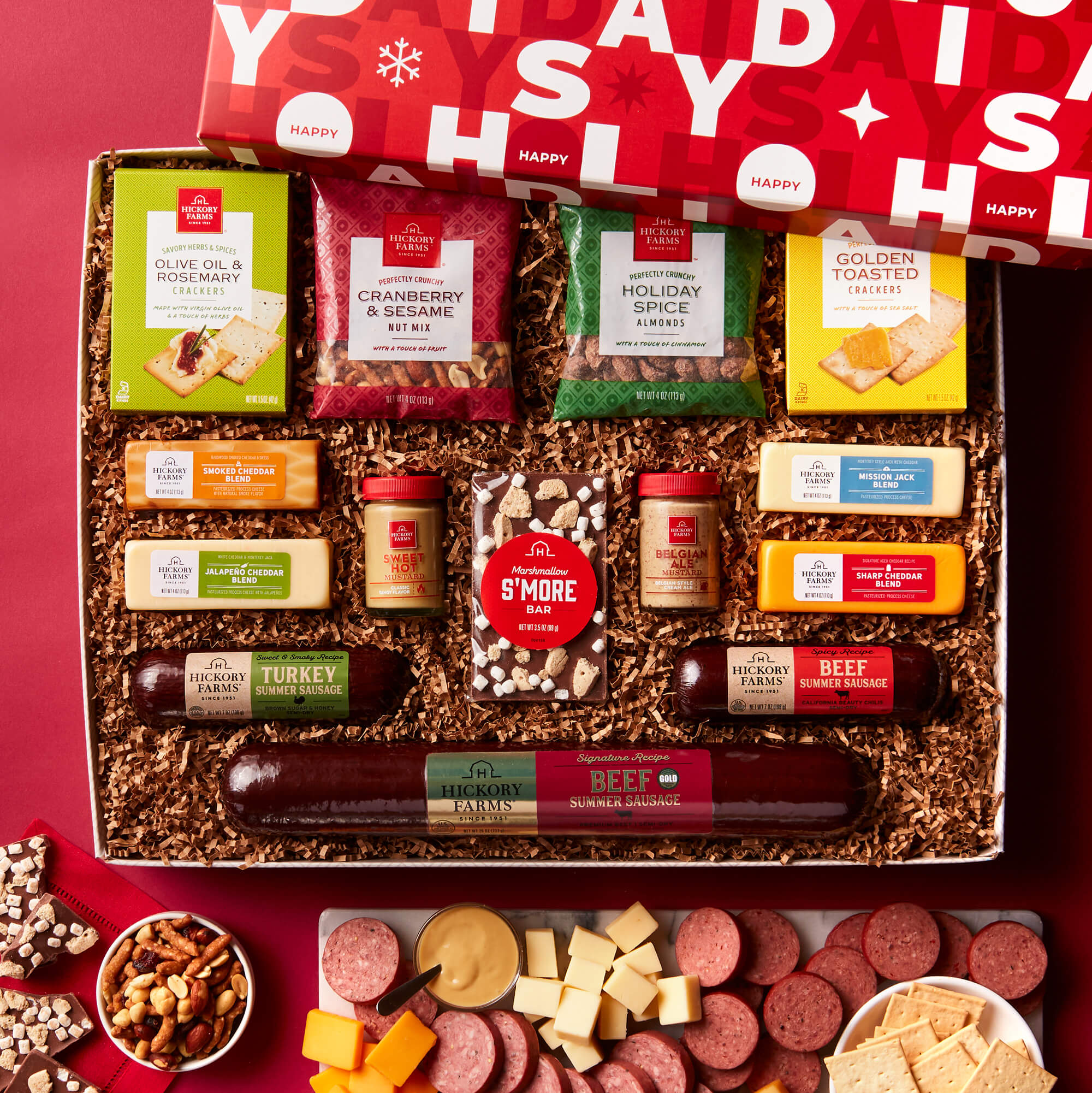 All Day Celebration Gift Box includes beef sausage, turkey sausage, various cheese and mustards, crackers, and chocolate